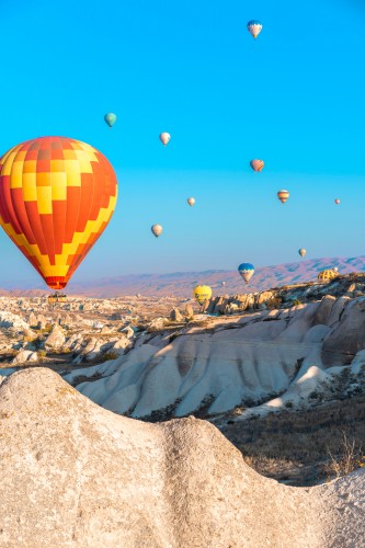 balloons-over-a-valley-in-cappadocia