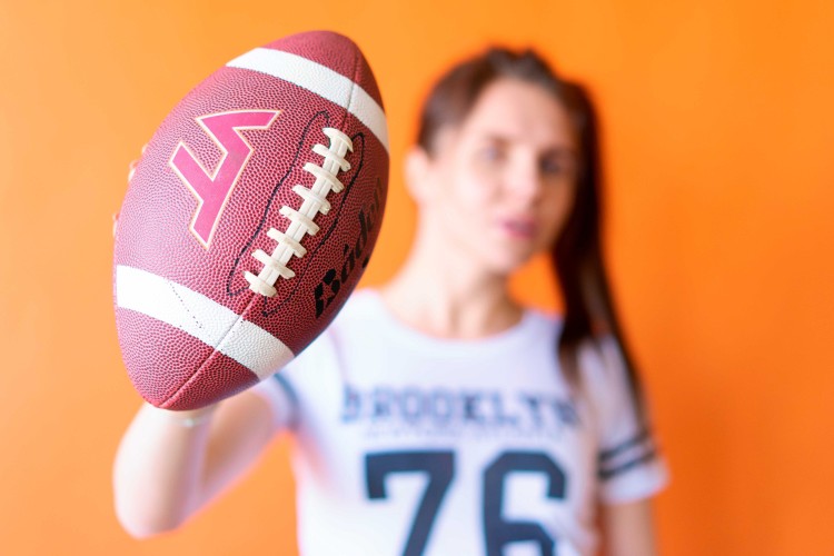 -beautiful-cheerleader-with-a-ball-in-her-hand
