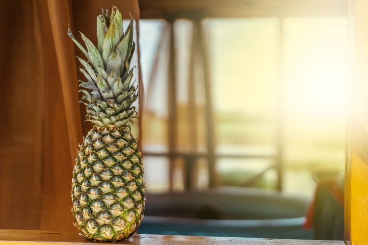 pineapple-on-the-background-of-a-wooden-windowsill