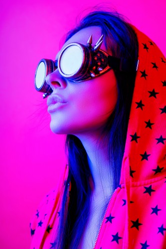beautiful-girl-in-steampunk-goggles-on-a-pink-background