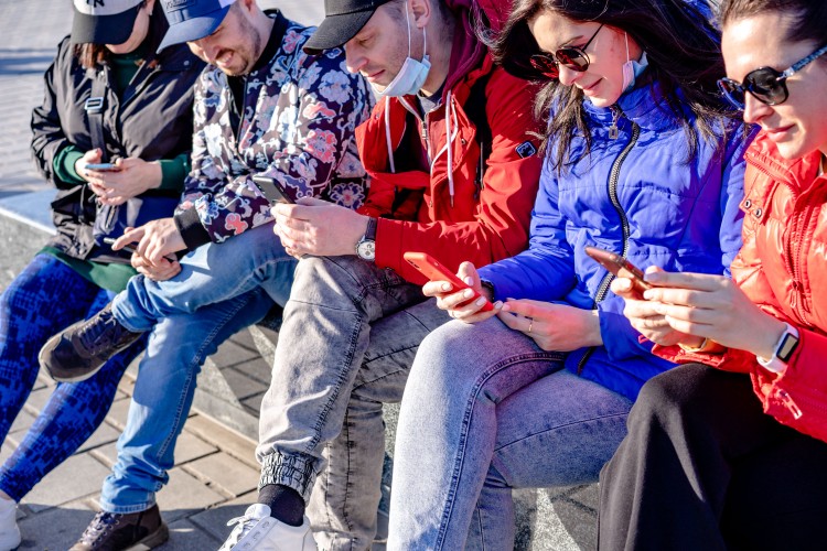 a-group-of-people-with-smartphones-in-their-hands