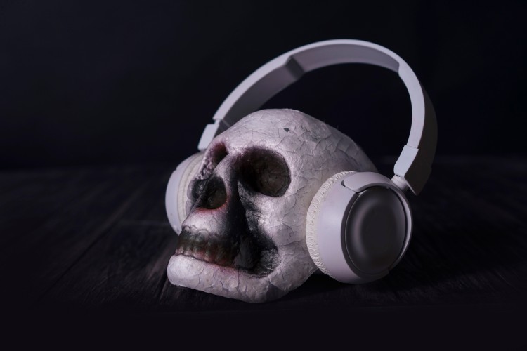 scary-skull-in-headphones-on-a-black-background