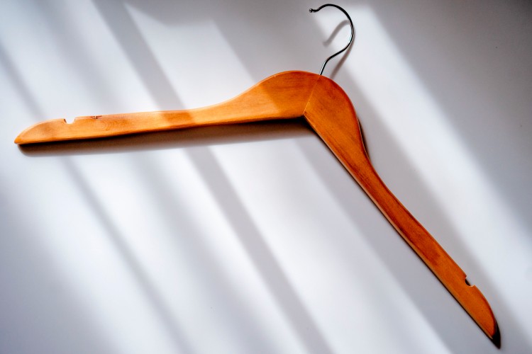 wooden-hanger-on-the-light-background