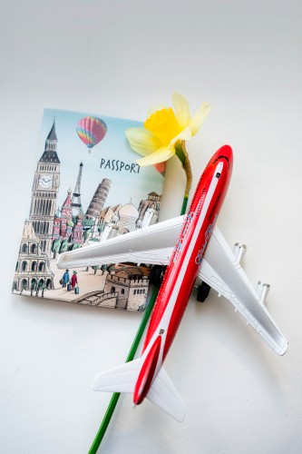 travel-concept-with-passport-and-toy-plane