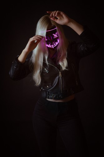 girl-in-neon-mask-posing-on-black-background