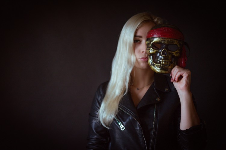 stylish-blonde-woman-with-halloween-skull-mask