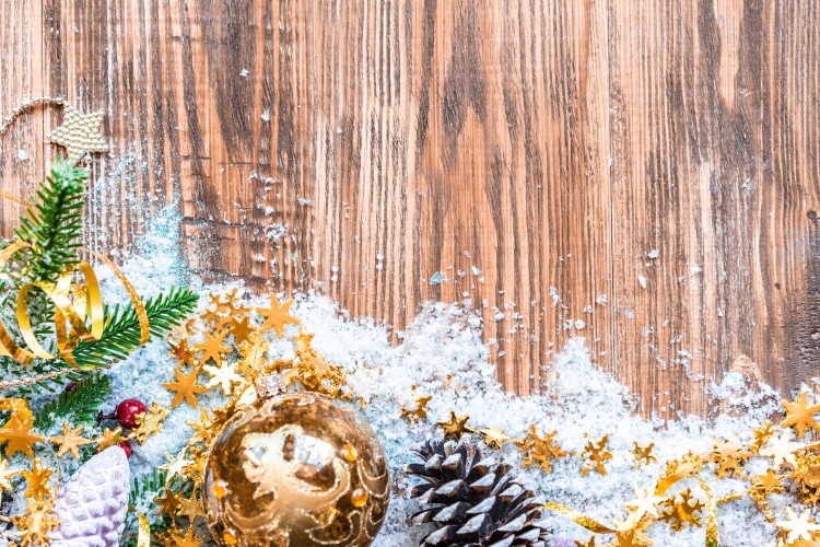 christmas-tree-decorations-on-a-wooden-background