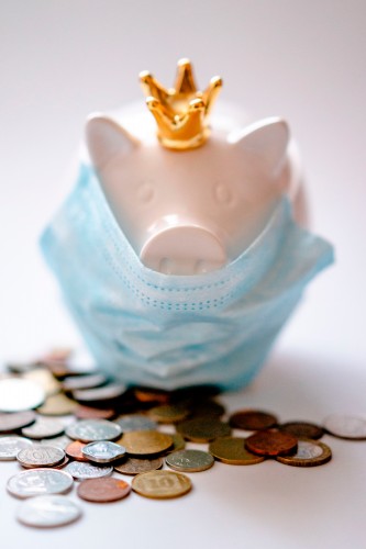 coins-and-piggybank-in-medical-mask