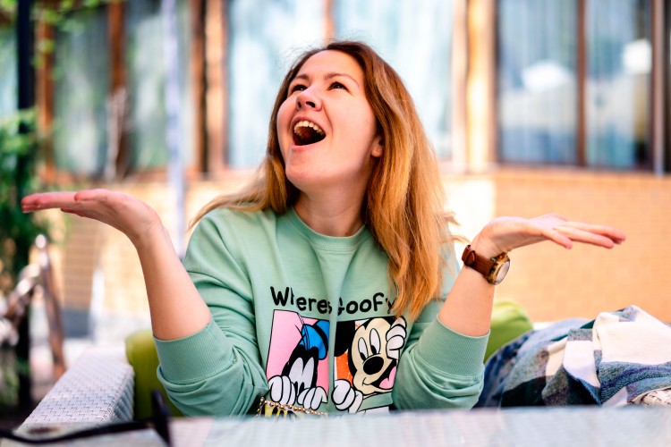 excited-woman-wearing-sweatshirt-with-cartoons