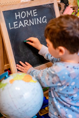 home-learning-concept-with-kid-and-the-blackboard