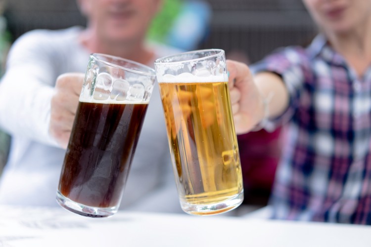blurred-photo-of-people-holding-beer-glasses
