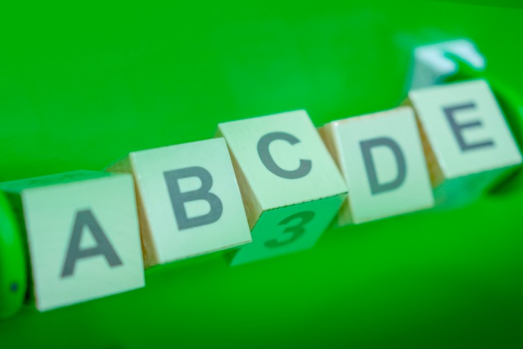 educational-cubes-with-letters-on-the-green-background
