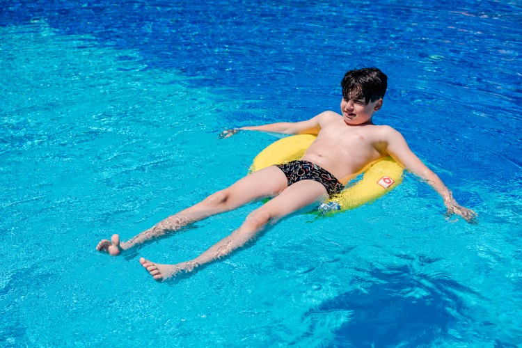 boy-with-swim-ring-in-the-pool
