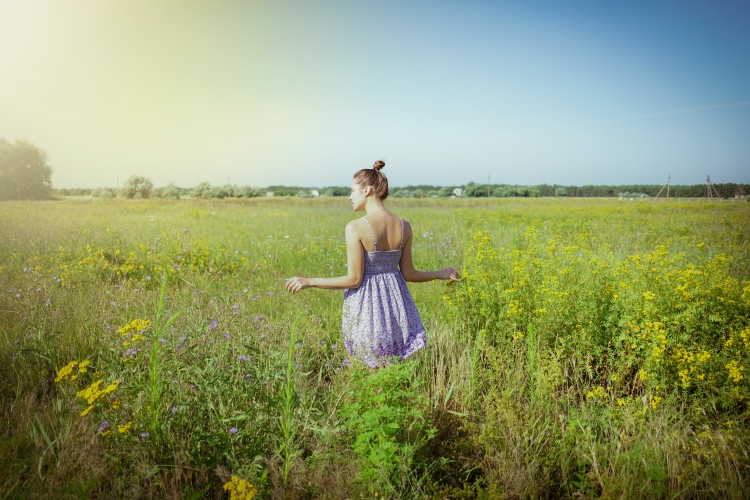 pretty-young-woman-in-sundress-on-a-ranch