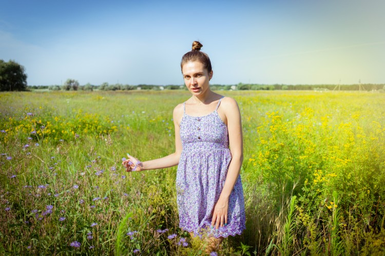 pretty-young-woman-in-summer-sundress-on-a-ranch-