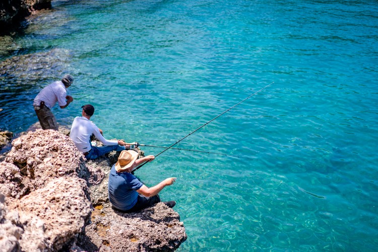 people-are-fishing-at-the-sea-coast