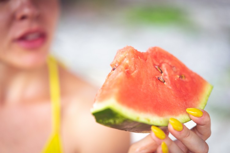 selective-focus-of-a-woman-holding-watermelon
