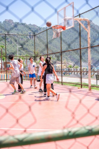 young-people-playing-basketball-in-summer-day