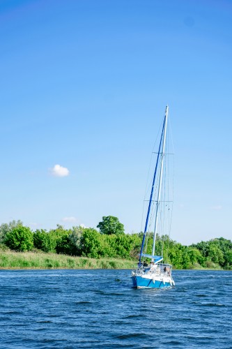 sailing-boat-on-the-background-of-the-summer-landscape