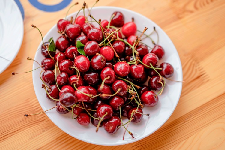 red-cherries-in-a-white-plate