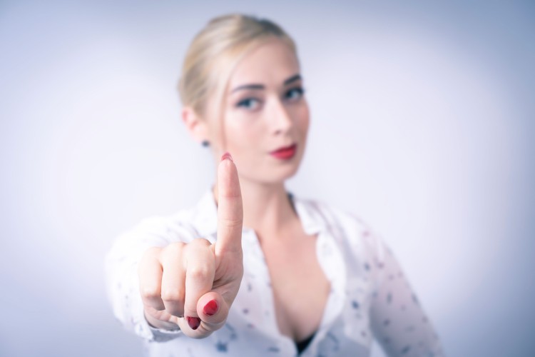 young-blond-woman-in-white-shirt-with-gestures