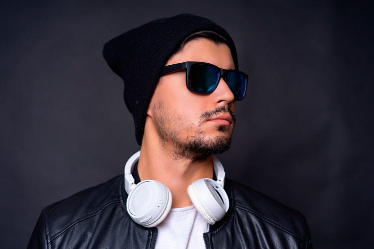man-in-hat-sunglasses-and-headphones