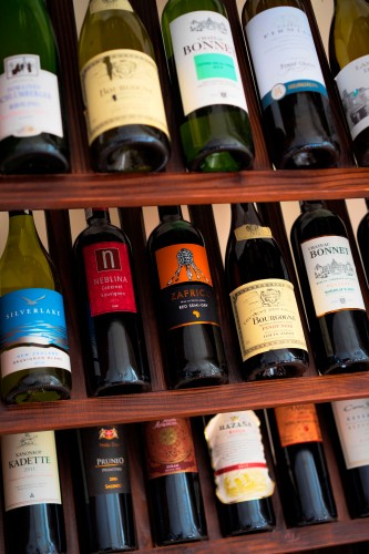 wine-bottles-on-a-wooden-shelf