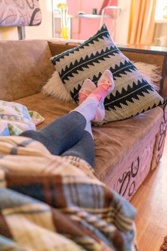 woman-in-socks-on-the-sofa