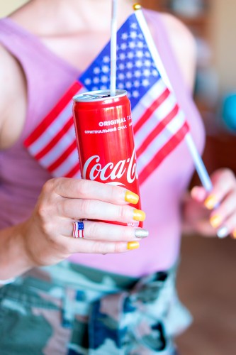 woman-holding-coke-and-american-flag