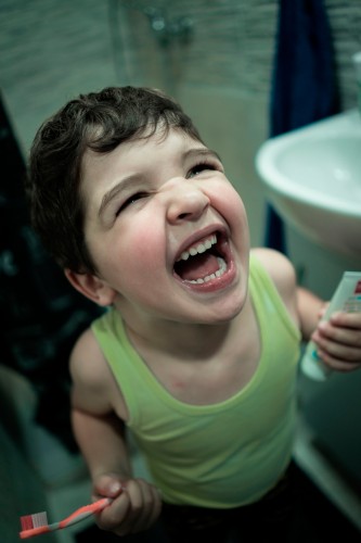 excited-kid-holding-toothbrush-and-toothpaste