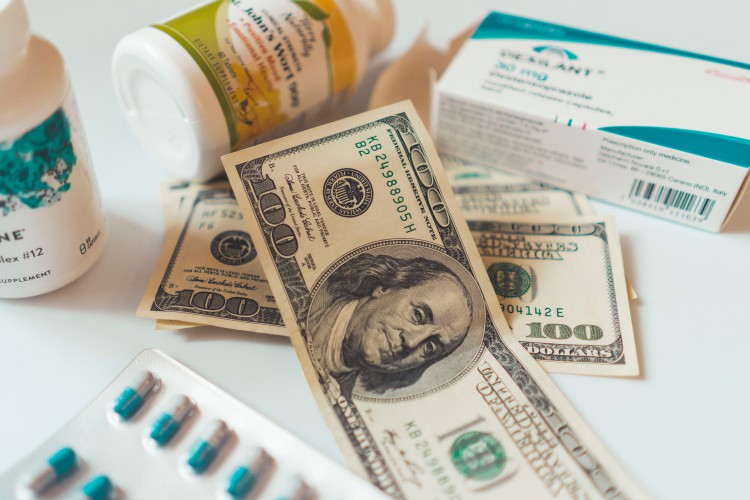 dollar-bills-on-the-background-of-medicines