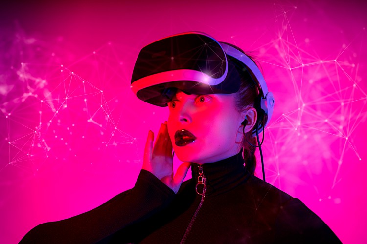 a-girl-using-glasses-of-virtual-reality-on-pink-background