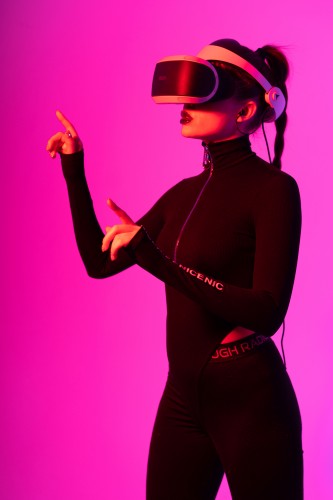 -amazing-young-woman-touching-the-air-during-vr-experience