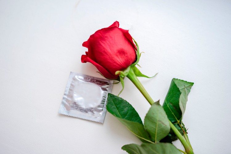 rose-and-contraceptive-on-a-white-background