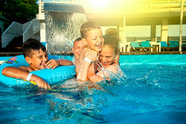 family-having-fun-in-the-swimming-pool