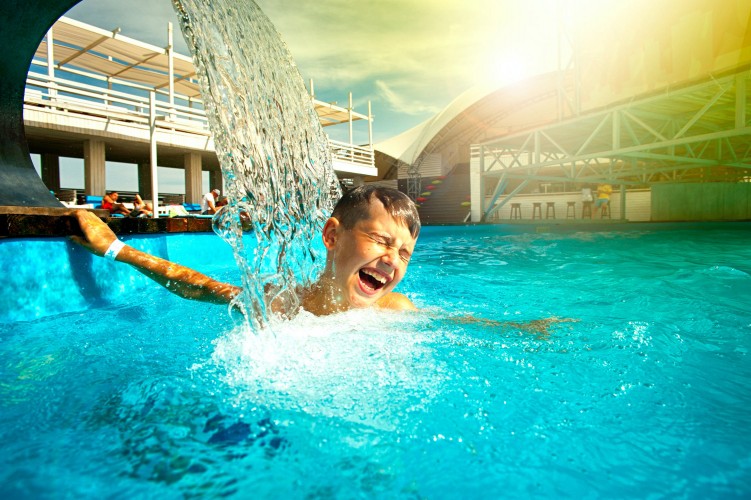 laughing-boy-swimming-in-the-water-park
