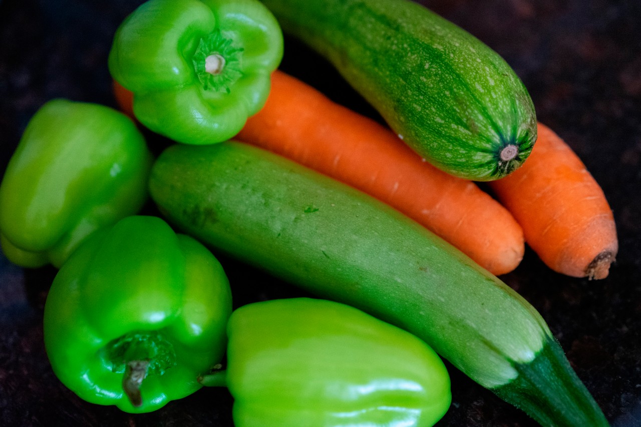 Top view of fresh vegetables on dark background