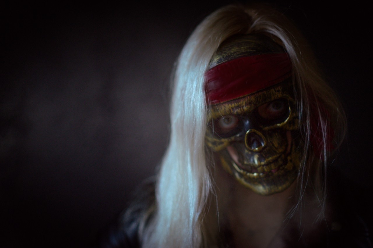 Blonde woman in skull mask
