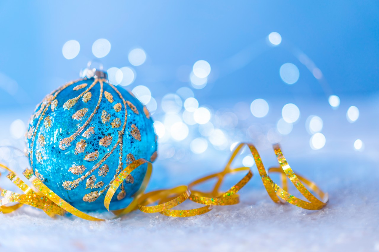 Blue Christmas ball and gold tinsel