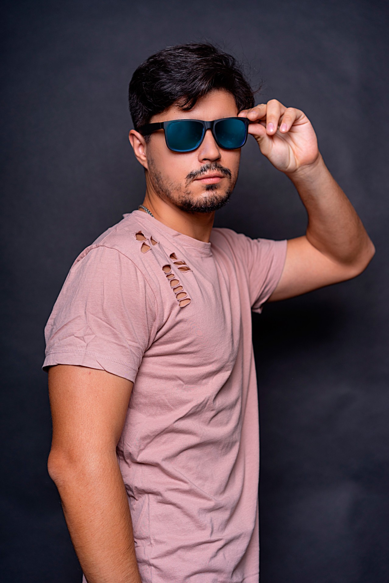 Stylish young man in the sunglasses