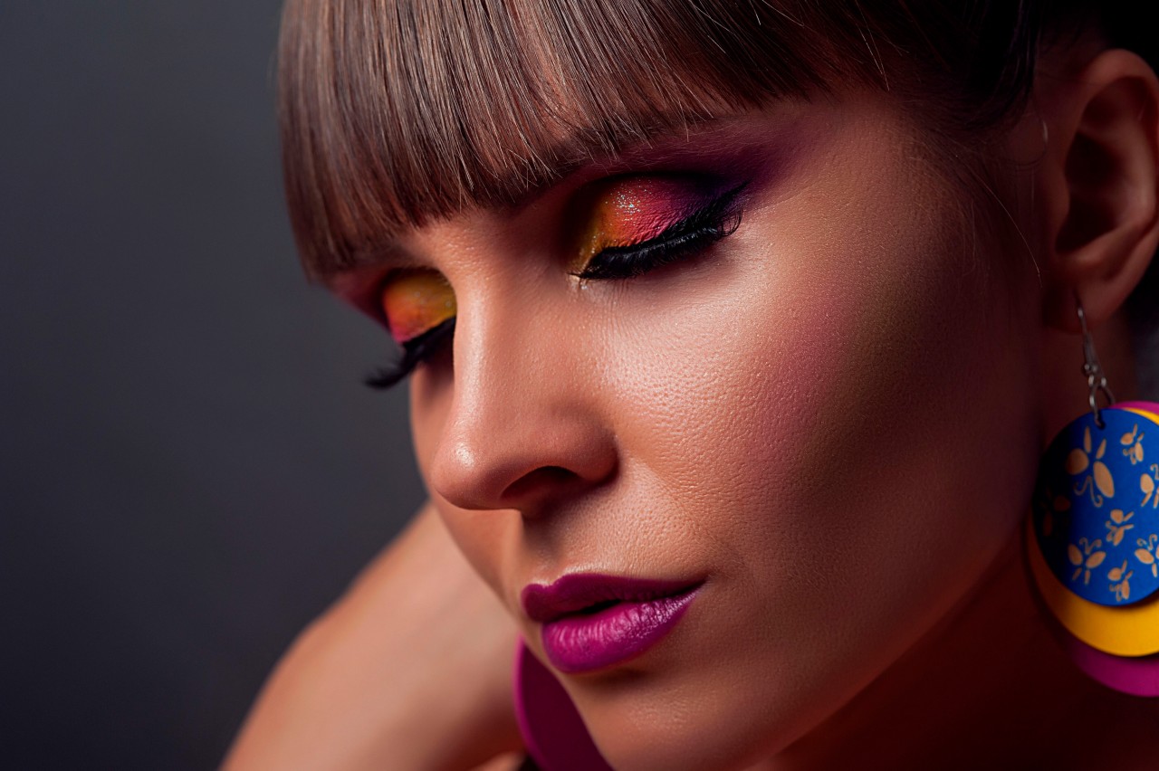 Model with Colored Makeup and Earrings