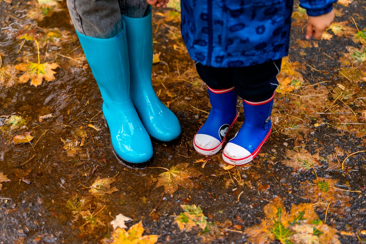  Mother and Child in Rubber Boots During the Rain