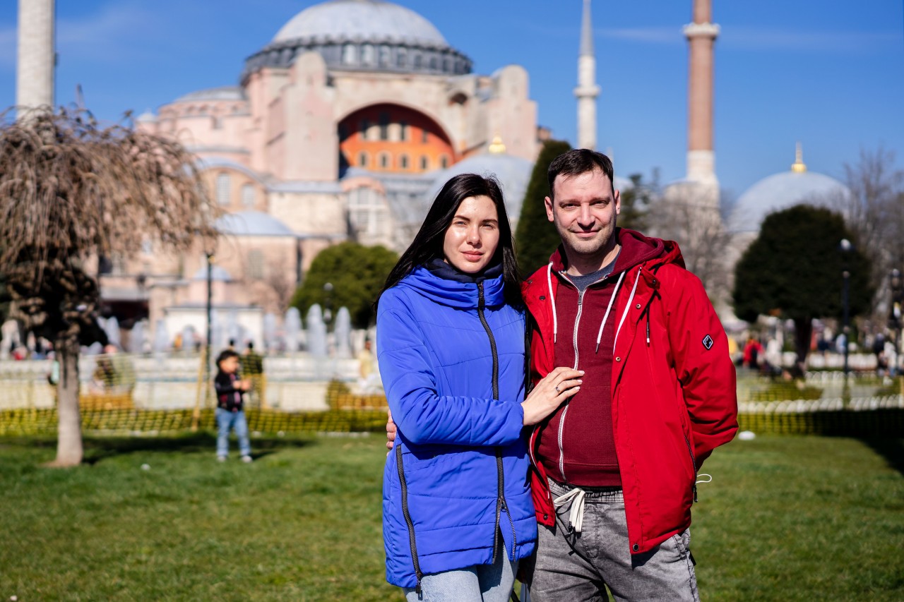 Beautiful Young Couple on the Background of the Old Mosque