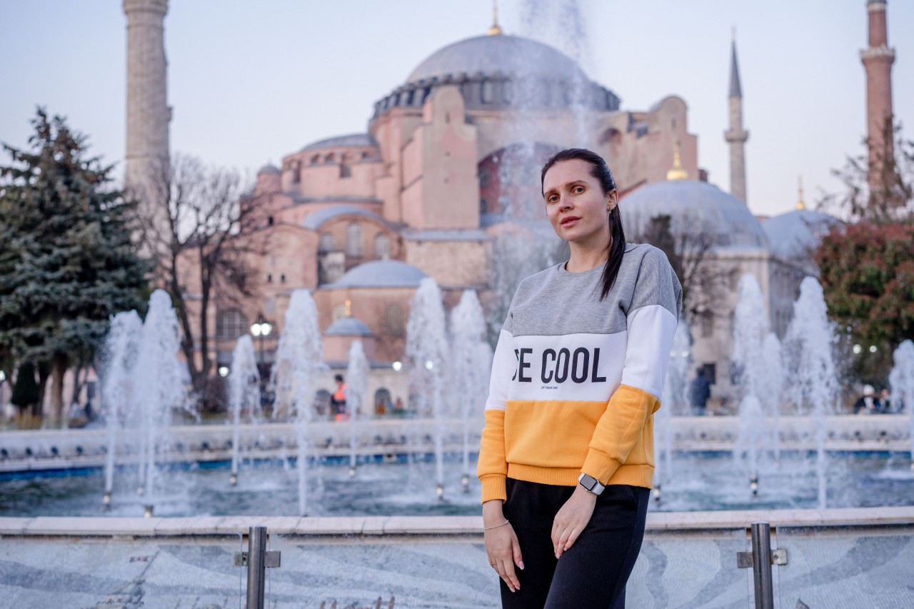 Young Woman on the Background of the Turkish Mosque