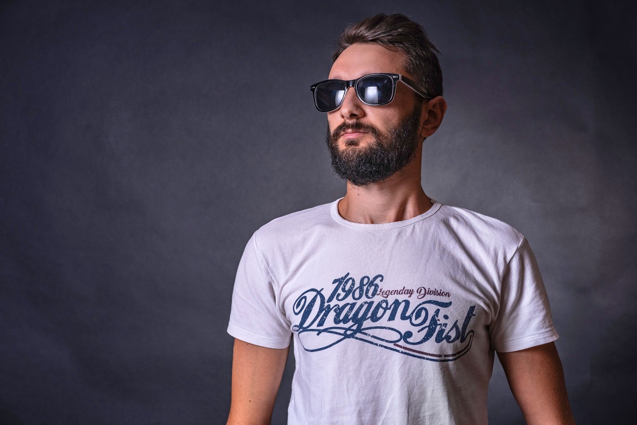 Fashionable Young Man with Beard in Sunglasses