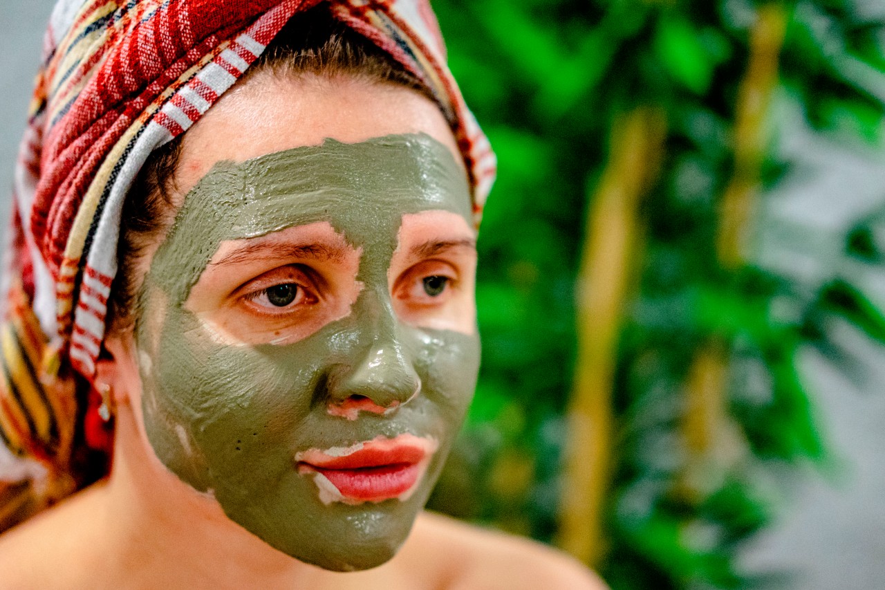 Woman with green facial mask