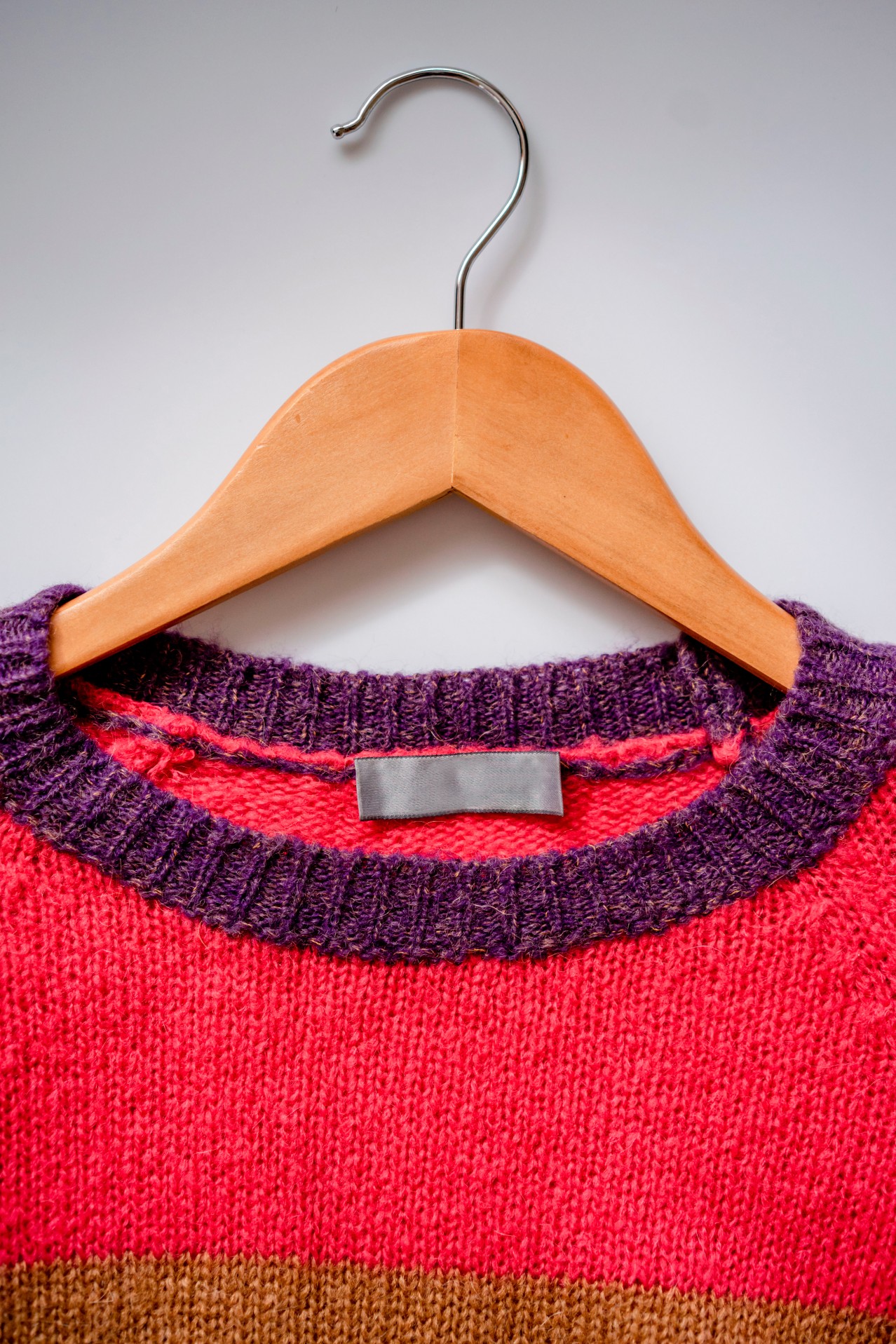 Sweater on the wooden hanger