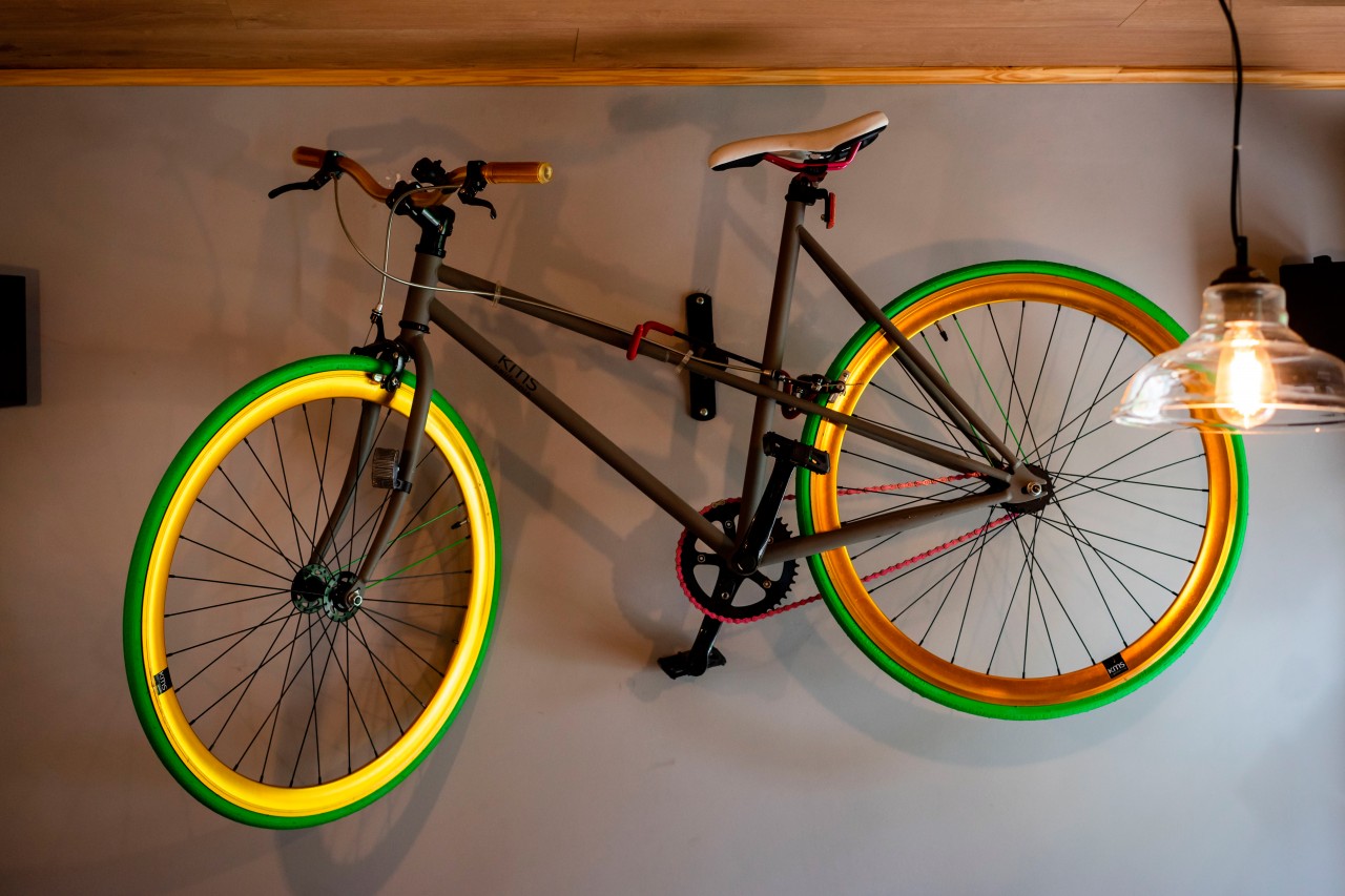Bicycle with green tires on the wall