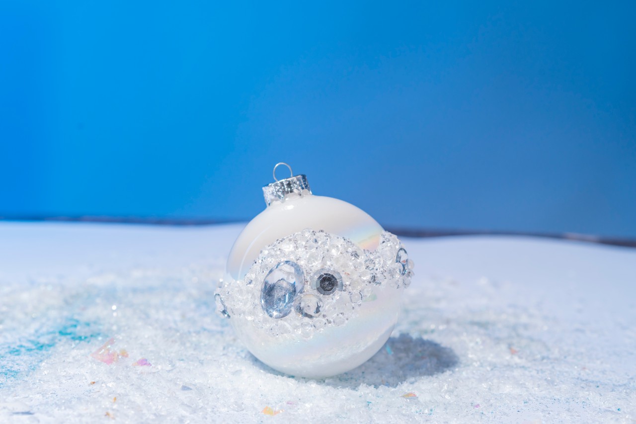 White Christmas ball decorated with rhinestones