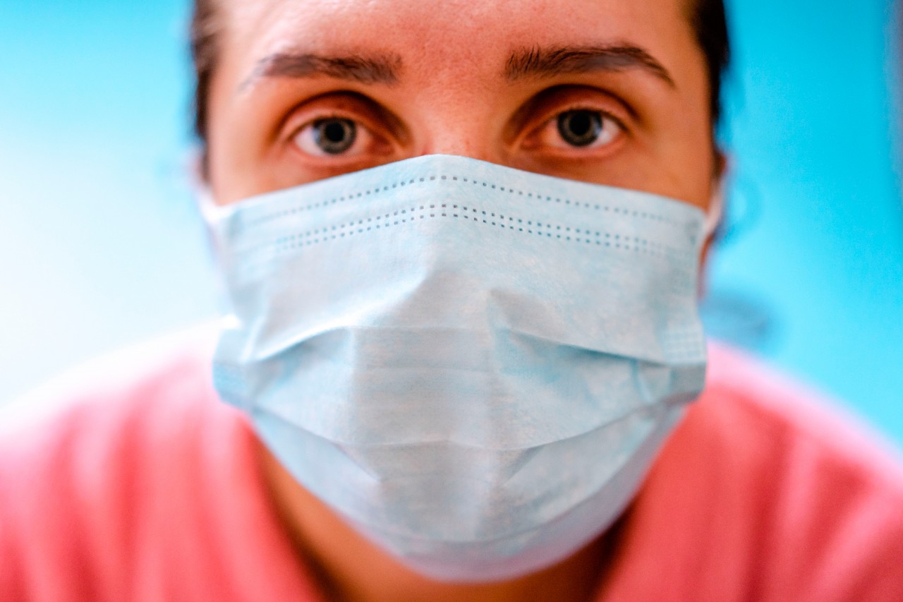 Young woman in medical mask
